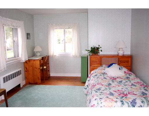 24 Longfellow Road Needham, MA 02494 - Photo 6 of 10 a bedroom with a bed and a window