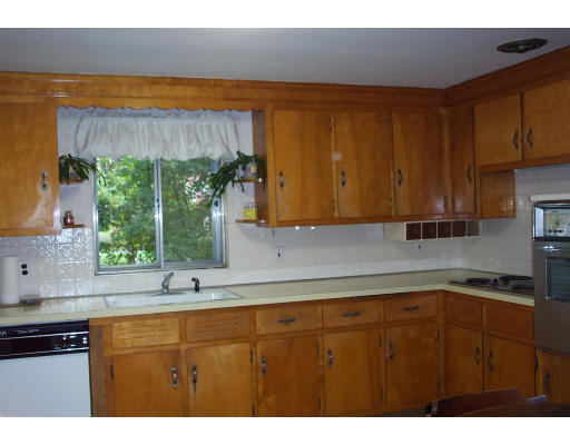 24 Longfellow Road Needham, MA 02494 - Photo 7 of 10 a kitchen with a sink a window and cabinets