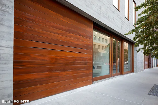 a view of a patio with table and chairs and potted plants