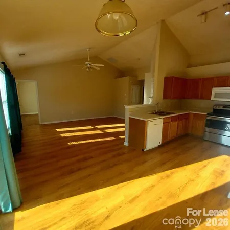 a view of kitchen and wooden floor