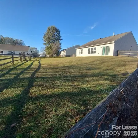 a view of a house with a big yard