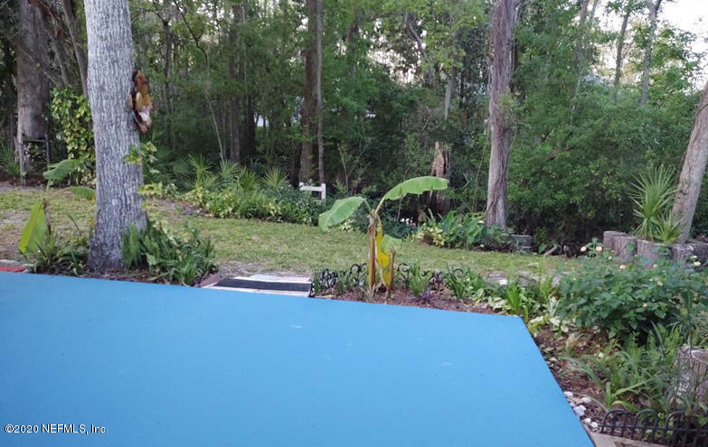 1780 Denmark Drive Fleming Island, FL 32003 - Photo 22 of 25 a view of a garden with plants and large trees