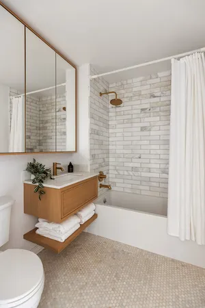 a bed room with a bed and a night stand