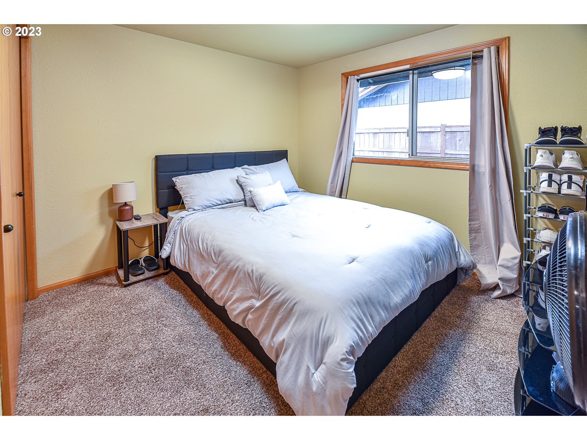 5676 D Street Springfield, OR 97478 - Photo 21 of 29 a bedroom with a bed next to a window