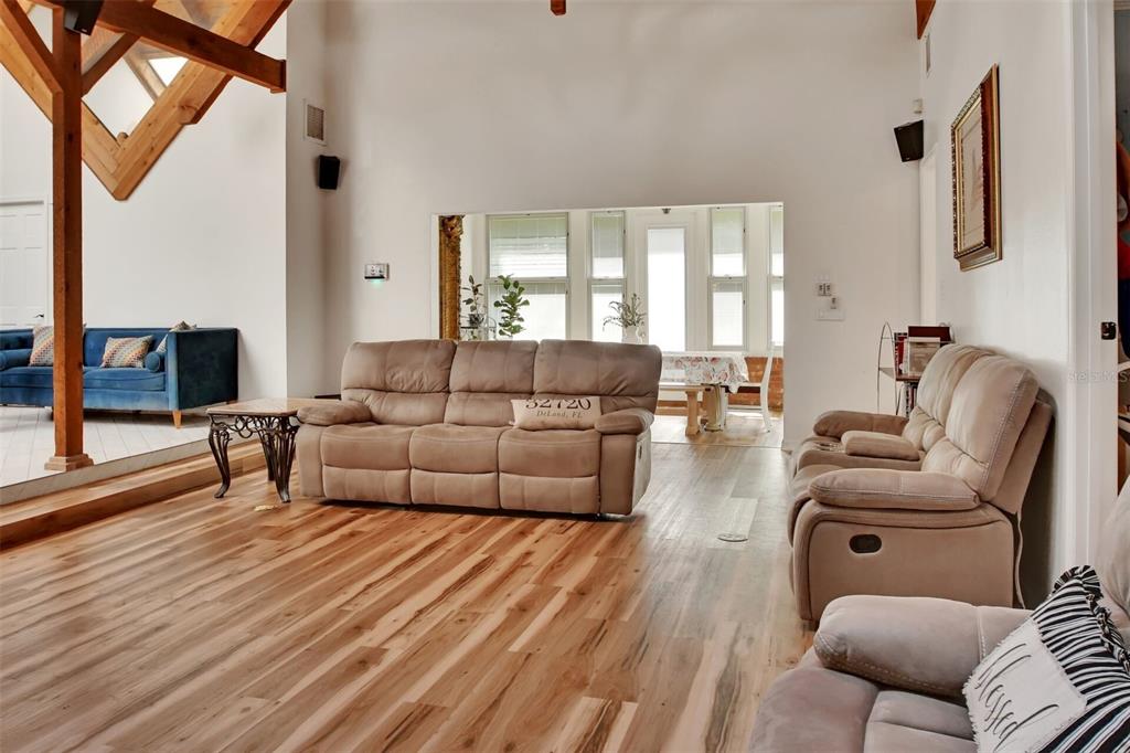 238 Crooked Tree Trail DeLand, FL 32724 - Photo 2 of 2 a living room with furniture and a flat screen tv