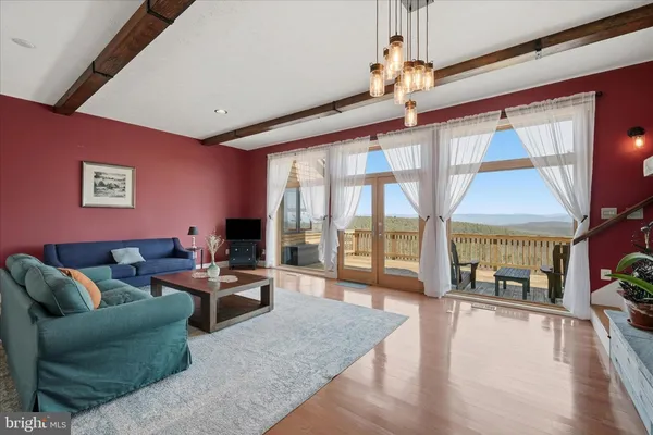 a large white kitchen with stainless steel appliances lots of counter space and windows