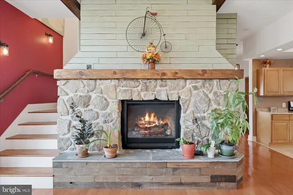 a large kitchen with stainless steel appliances granite countertop a sink and cabinets