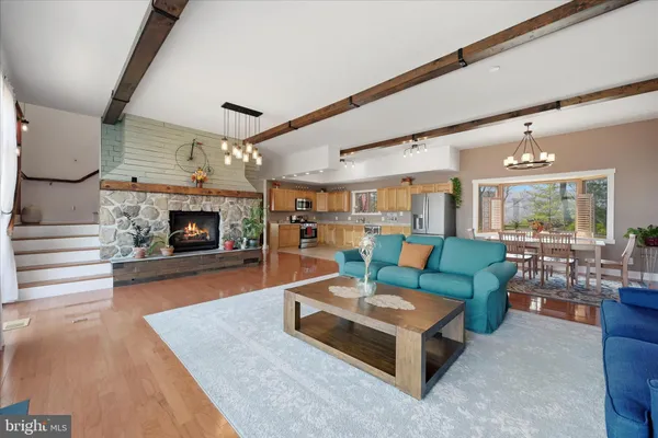 a kitchen with granite countertop white cabinets and a window