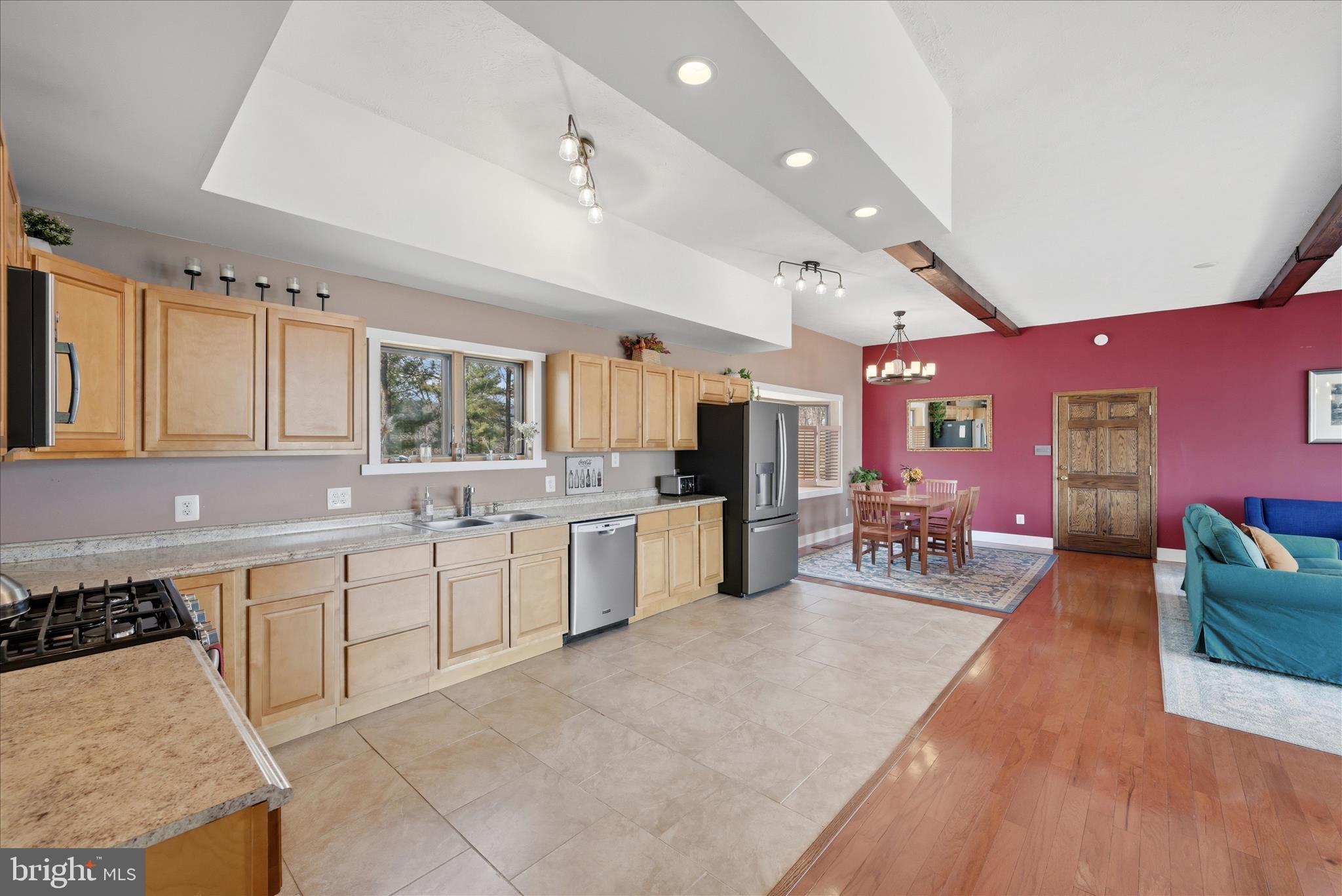 2152 Supinlick Ridge Road Broadway, VA 22815 - Photo 21 of 89 a large white kitchen with stainless steel appliances lots of counter space and windows