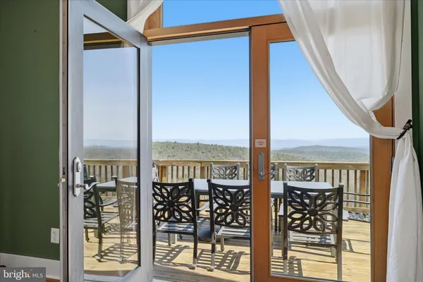 a bathroom with a tub a sink and mirrors