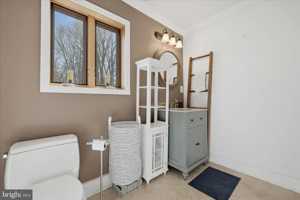 a view of dirt yard with a large tree