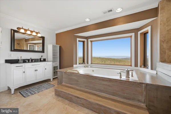 a view of a porch with furniture and floor to ceiling window