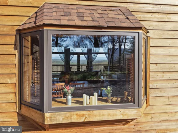 a lobby with furniture and a potted plant
