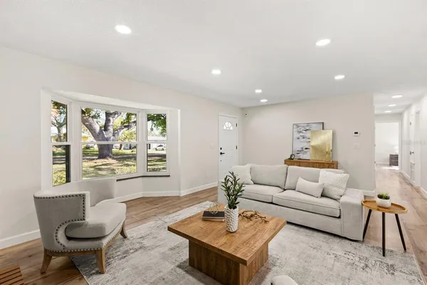 a living room with furniture and a window