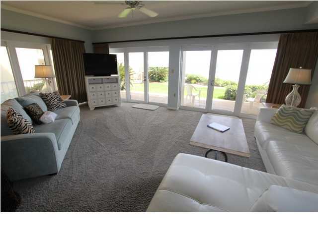 3668 County Road, Unit 101 Santa Rosa Beach, FL 32459 - Photo 12 of 33 a living room with furniture and a flat screen tv