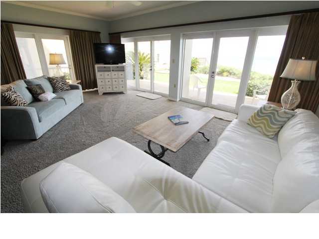 3668 County Road, Unit 101 Santa Rosa Beach, FL 32459 - Photo 13 of 33 a living room with furniture and a large window