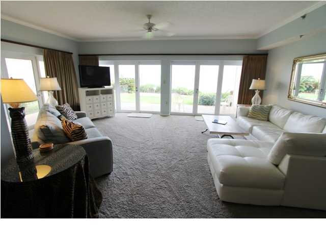 3668 County Road, Unit 101 Santa Rosa Beach, FL 32459 - Photo 14 of 33 a living room with furniture and a flat screen tv