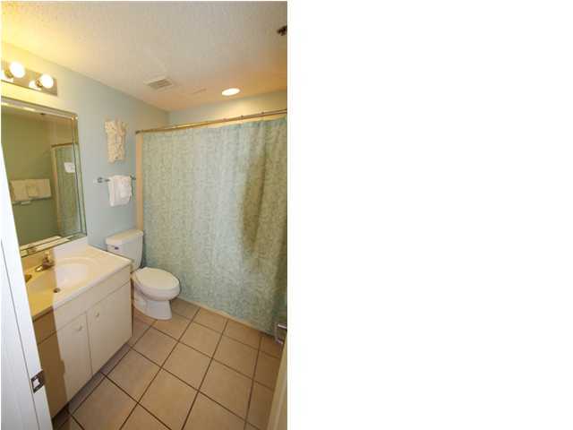 3668 County Road, Unit 101 Santa Rosa Beach, FL 32459 - Photo 24 of 33 a bathroom with a sink a toilet and shower
