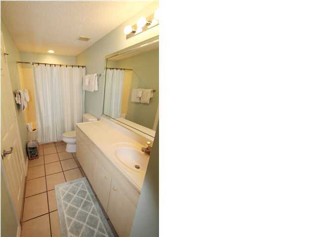 3668 County Road, Unit 101 Santa Rosa Beach, FL 32459 - Photo 27 of 33 a bathroom with a tub shower and a sink
