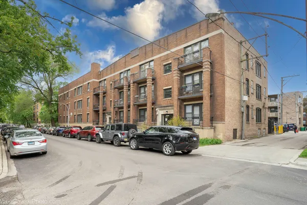 a building with cars parked in front of it