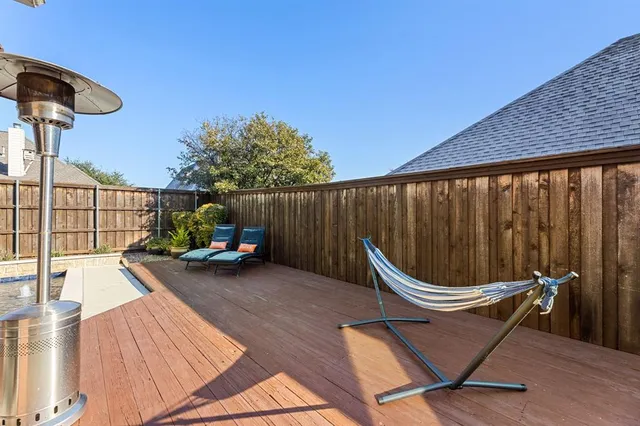 a view of a two chairs in the patio