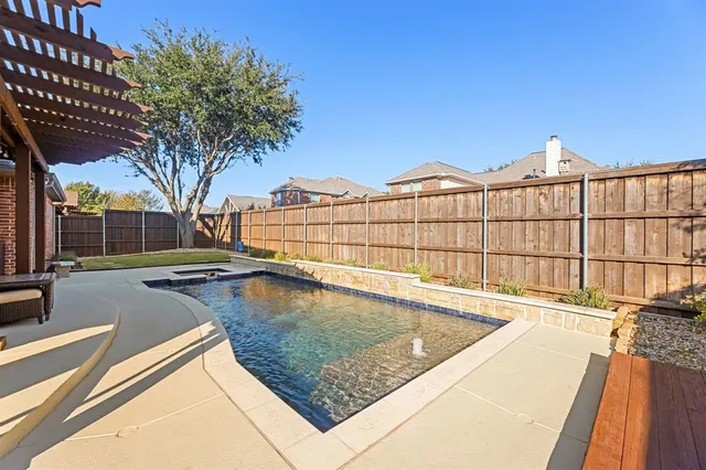 a view of a swimming pool with a patio