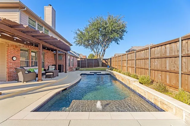 a view of a backyard with a patio