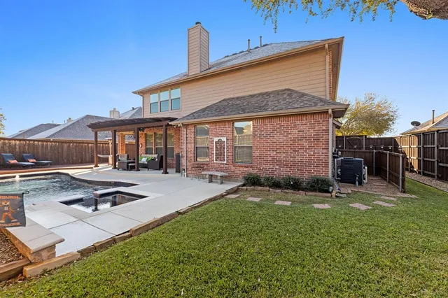 a backyard of a house with seating space