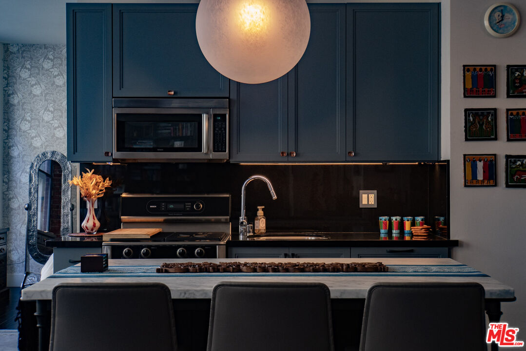 a kitchen with a stove and a microwave