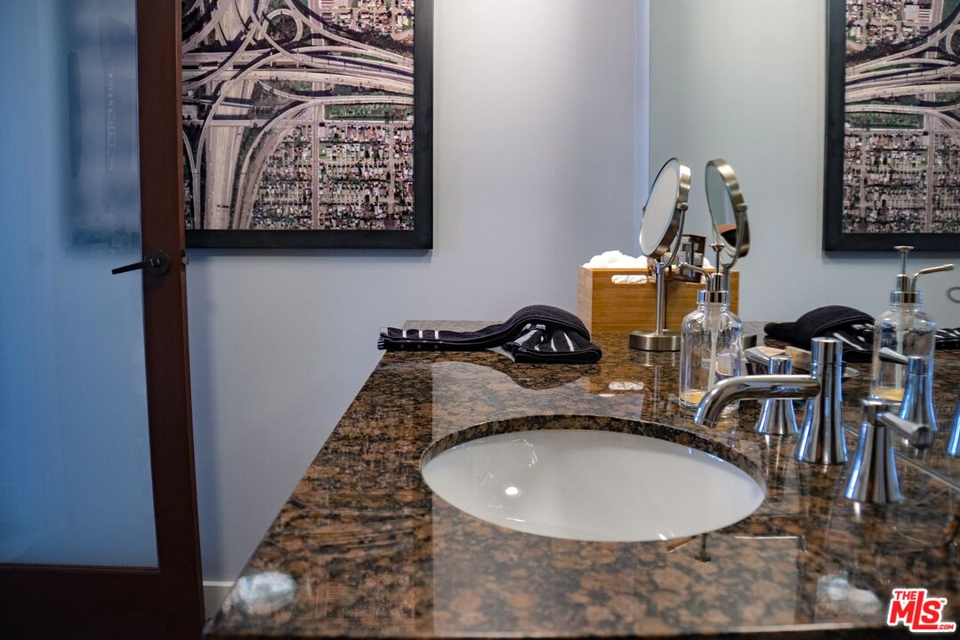 460 South Spring Street, Unit 514 Los Angeles, CA 90013 - Photo 11 of 50 a bathroom with a sink and a mirror