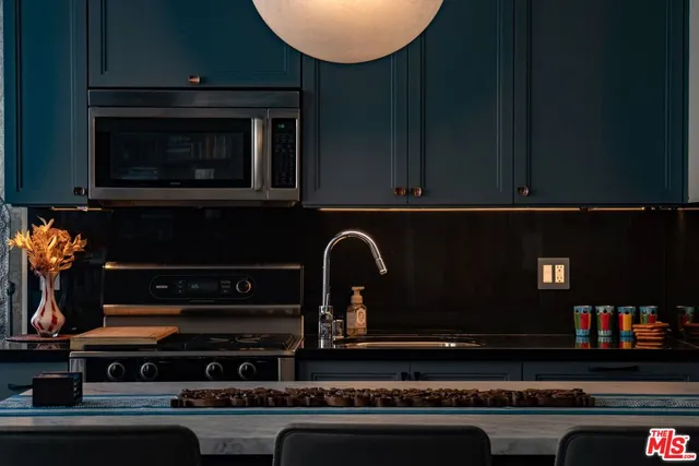 a kitchen with a stove and a microwave