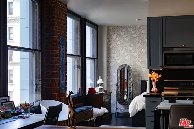 a view of living room with furniture and a window