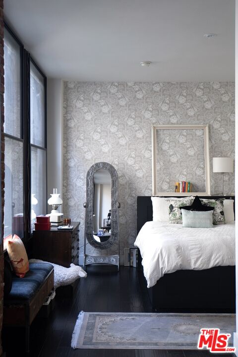 460 South Spring Street, Unit 514 Los Angeles, CA 90013 - Photo 16 of 50 a bedroom with a bed and wooden floor