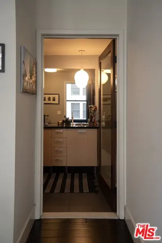 a bathroom with a mirror and a sink