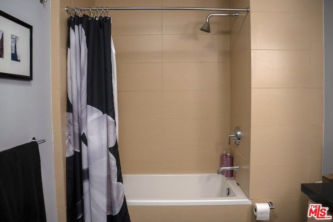 460 South Spring Street, Unit 514 Los Angeles, CA 90013 - Photo 19 of 50 a bathroom with a bathtub and a shower