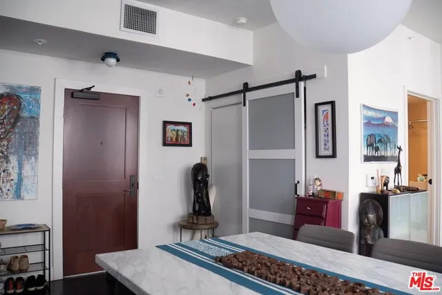 a living room with furniture and a rug