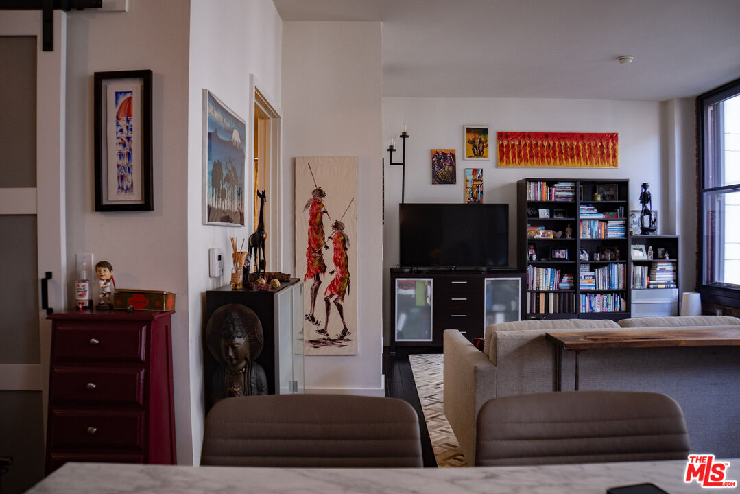 460 South Spring Street, Unit 514 Los Angeles, CA 90013 - Photo 27 of 50 a living room with furniture and a flat screen tv