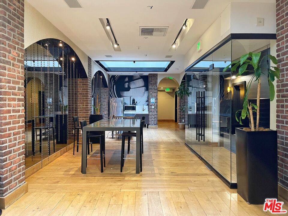 460 South Spring Street, Unit 514 Los Angeles, CA 90013 - Photo 38 of 50 a view of a dining hall with many windows
