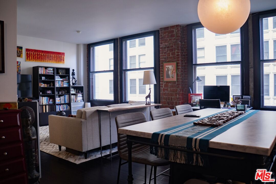 460 South Spring Street, Unit 514 Los Angeles, CA 90013 - Photo 5 of 50 a dining room with furniture and a window