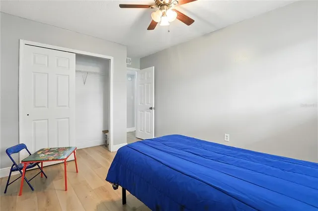 a bedroom with a bed and a chair