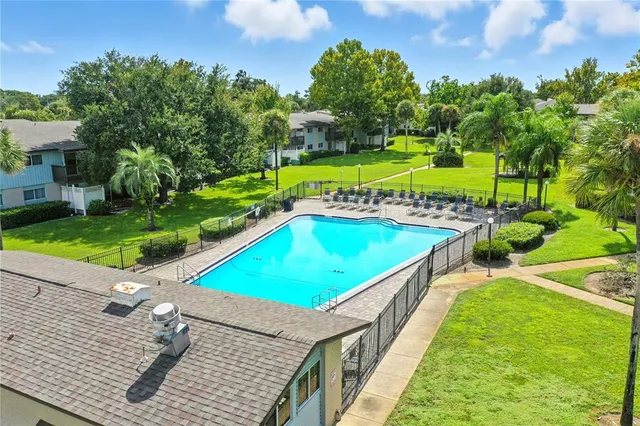 a view of a house with a yard porch and sitting area