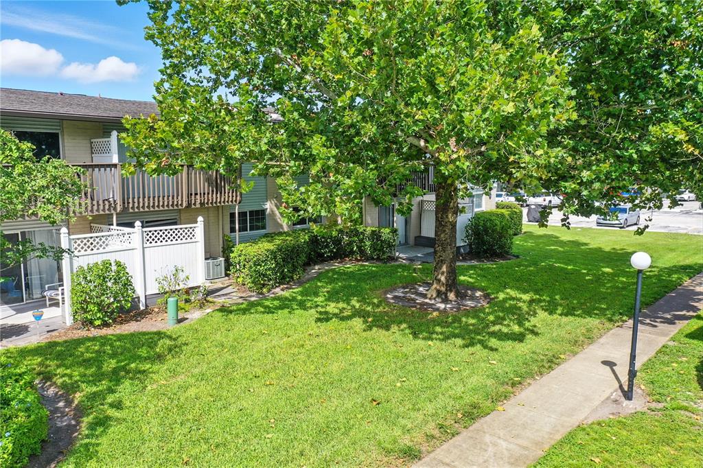 1695 Lee Road, Unit D113 Winter Park, FL 32789 - Photo 32 of 34 a house view with a garden space