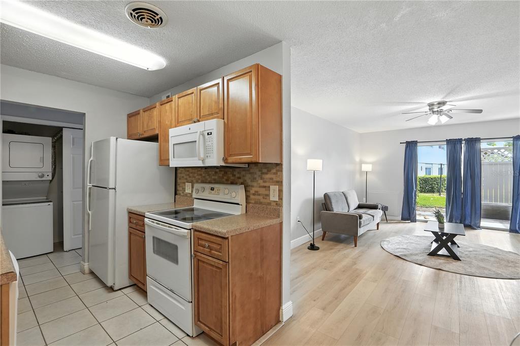 1695 Lee Road, Unit D113 Winter Park, FL 32789 - Photo 6 of 34 a kitchen with a sink appliances and cabinets