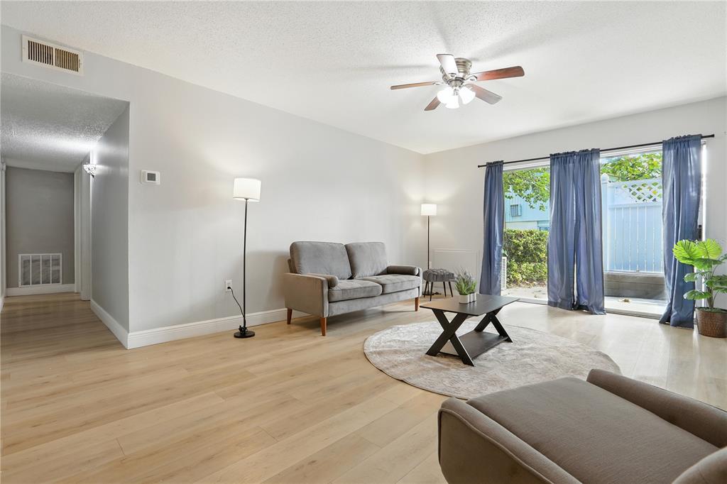 1695 Lee Road, Unit D113 Winter Park, FL 32789 - Photo 8 of 34 a living room with furniture and window