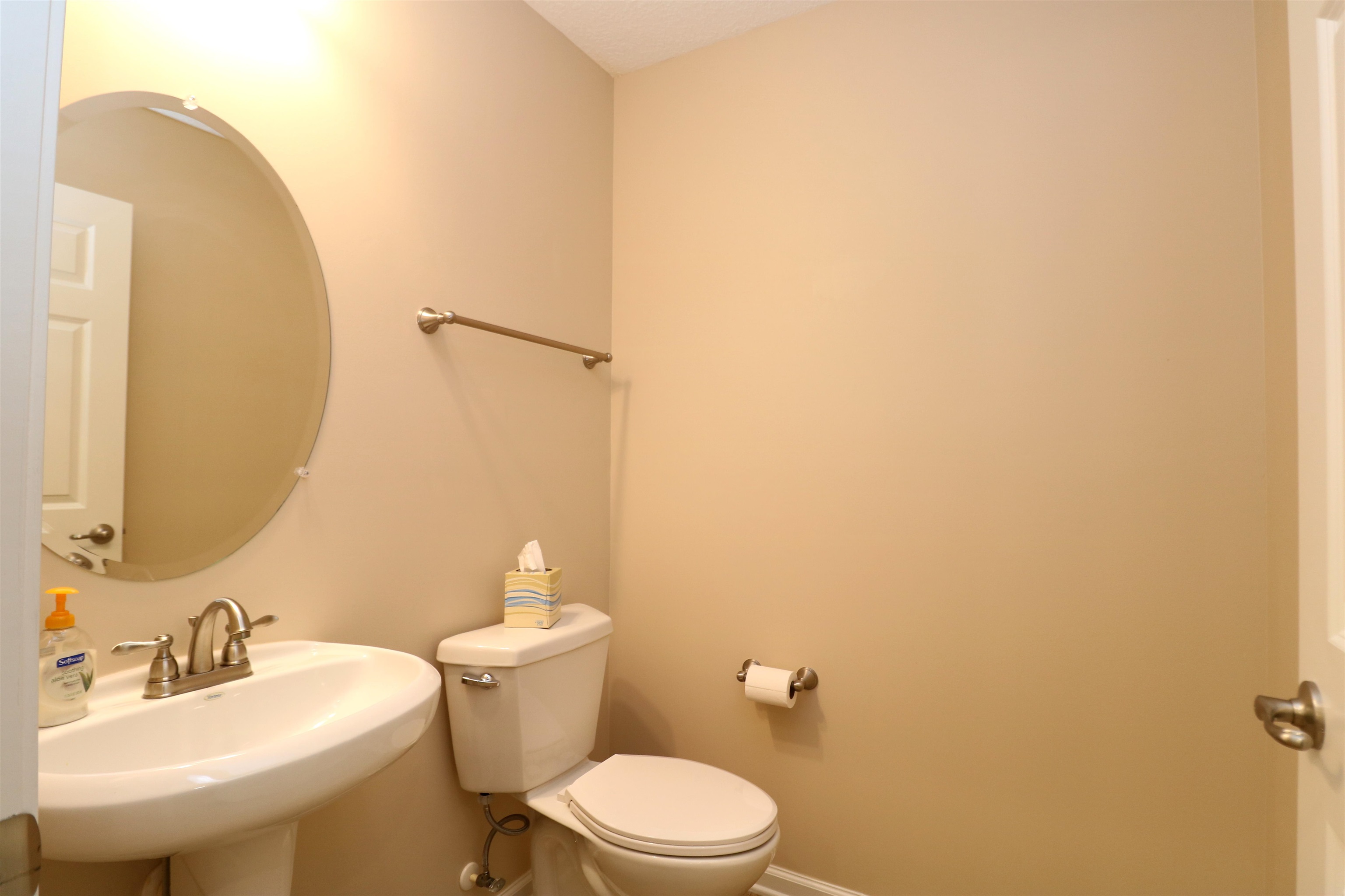 189 Amistad Drive St. Augustine, FL 32086 - Photo 11 of 47 a bathroom with a sink mirror and toilet