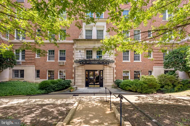 a front view of a building with garden