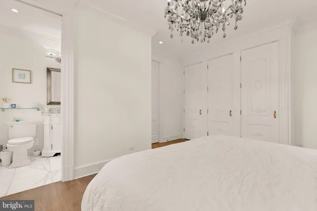 a bedroom with a bed and a view of bathroom