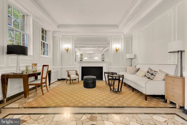 a front view of a house with a yard and a garden