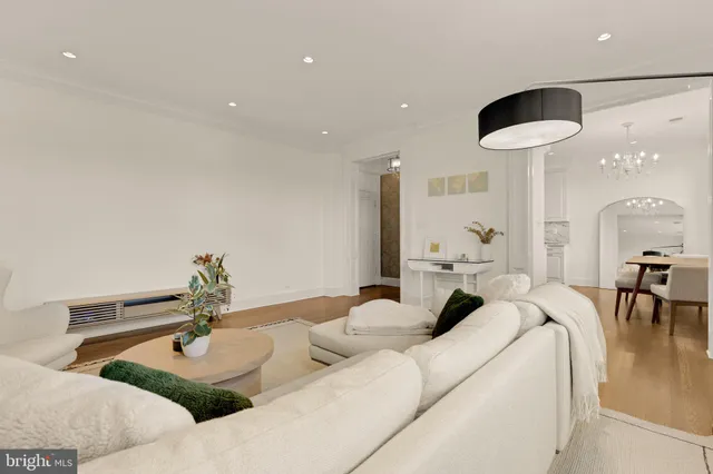 a living room with furniture and a lamp