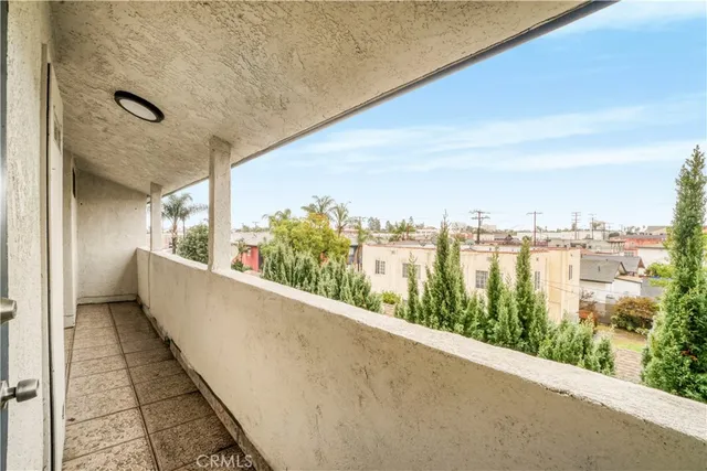 a view of balcony with city and ocean view